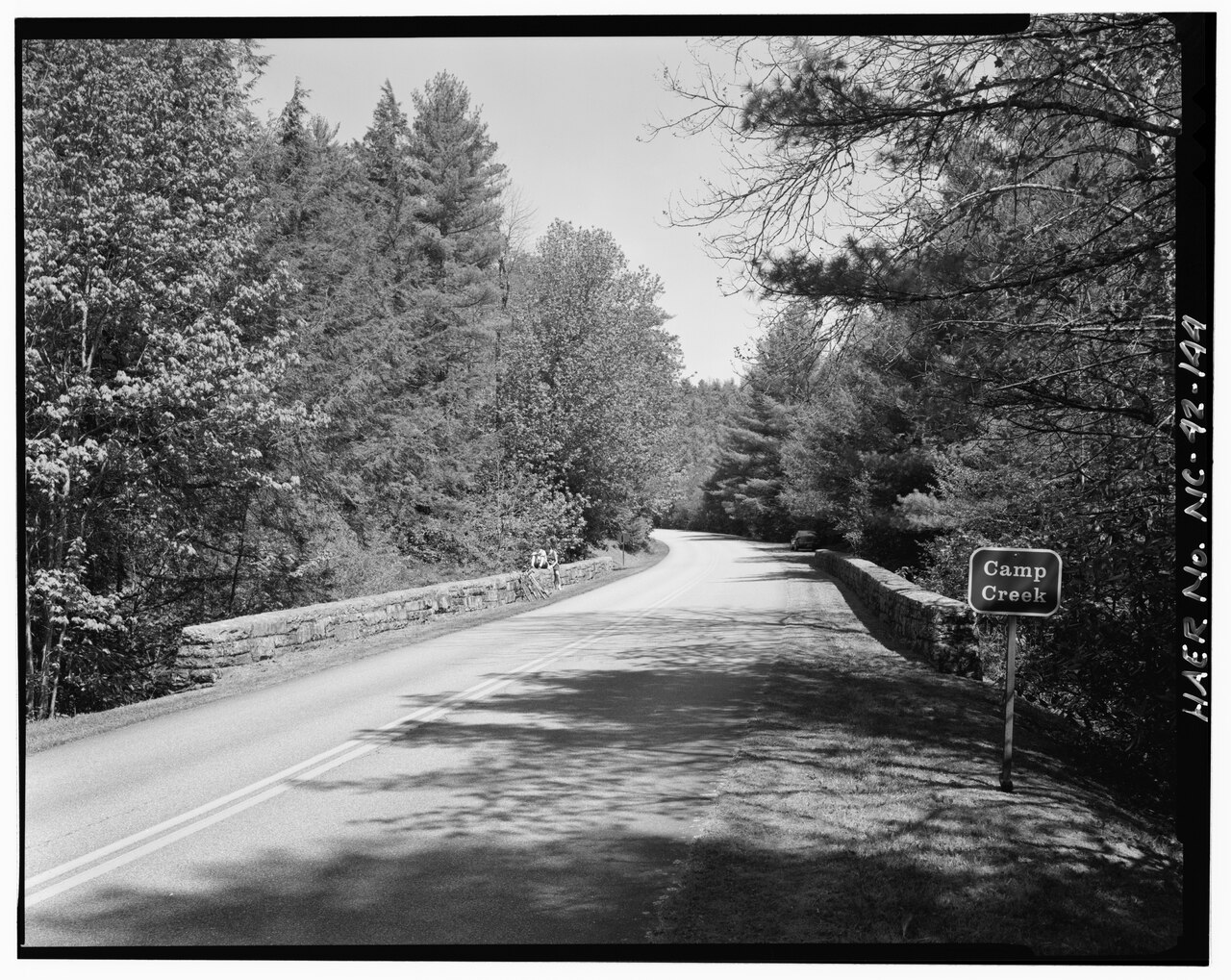 Pragmatic Rails AI Agents: The Antidote to Hype — Camp Creek Bridge. View of the road deck showing the stone-faced guard rails and the grass shoulders continuing across the bridge. Looking east-southeast. - Blue Ridge Parkway, Between Shenandoah National Park and Great Smoky Mountains, Asheville, Buncombe County, NC
