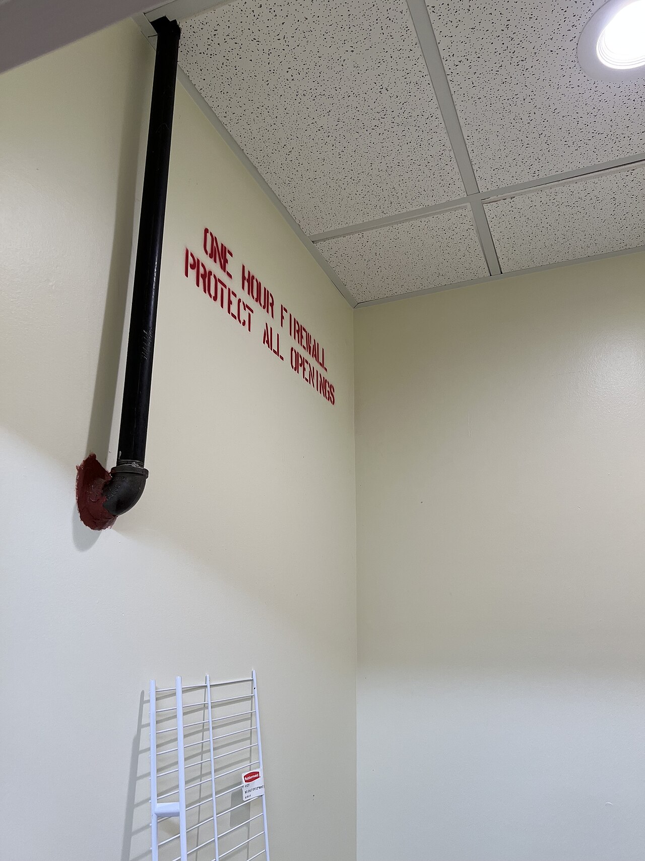 Stroq: A Firewall That Explains Why Your AI Agent Ran That Command — Firewall Painted Label on Wall
